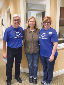 Dr. Kelemen and a volunteer with a participant